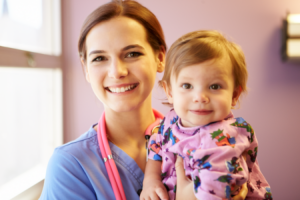 doctor carrying a baby